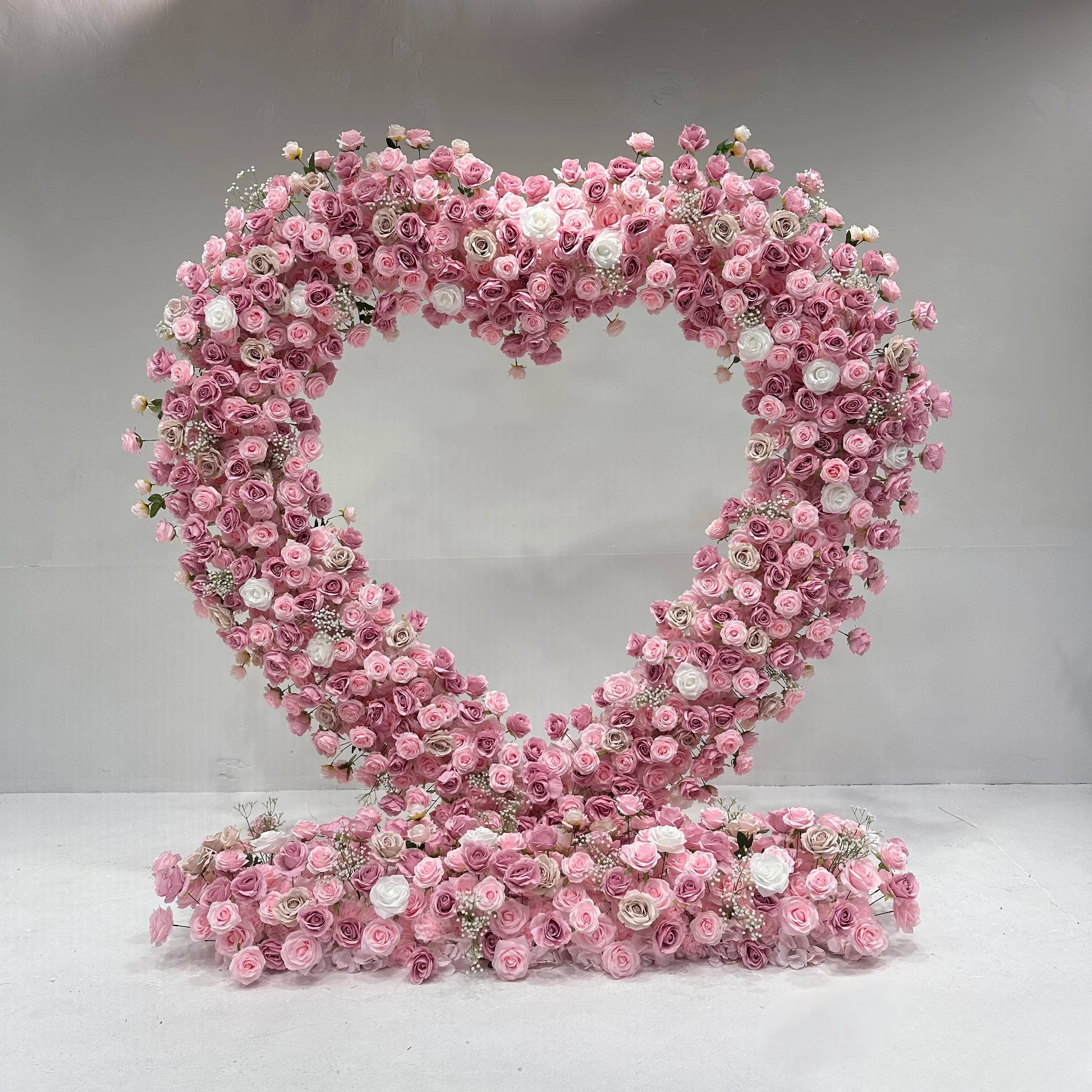 Pink heart - shaped flower arch for wedding banquet event backdrop
